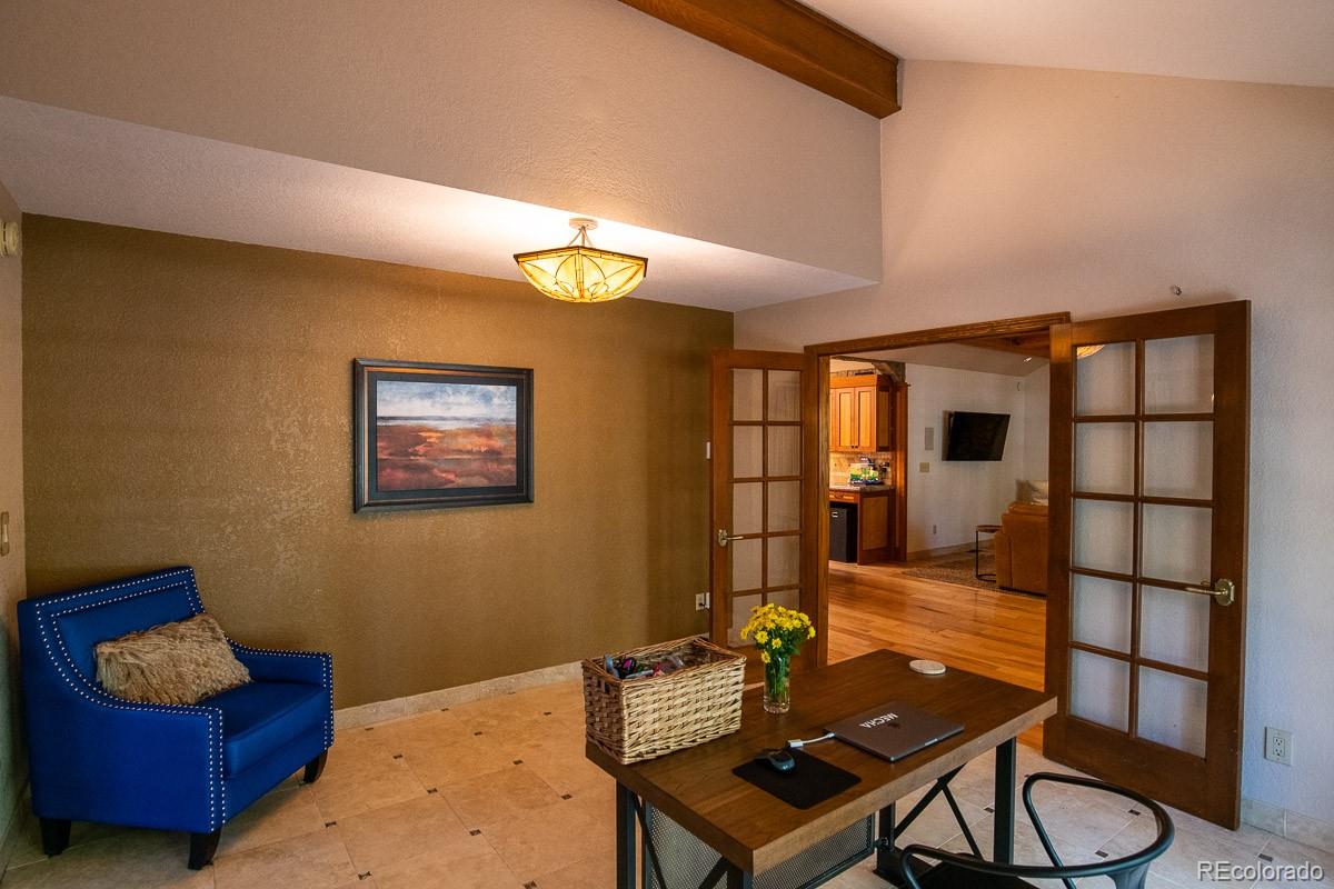 7181 Four Rivers Road Boulder, CO 80301 - Photo 15 of 35 a living room with furniture and wooden floor