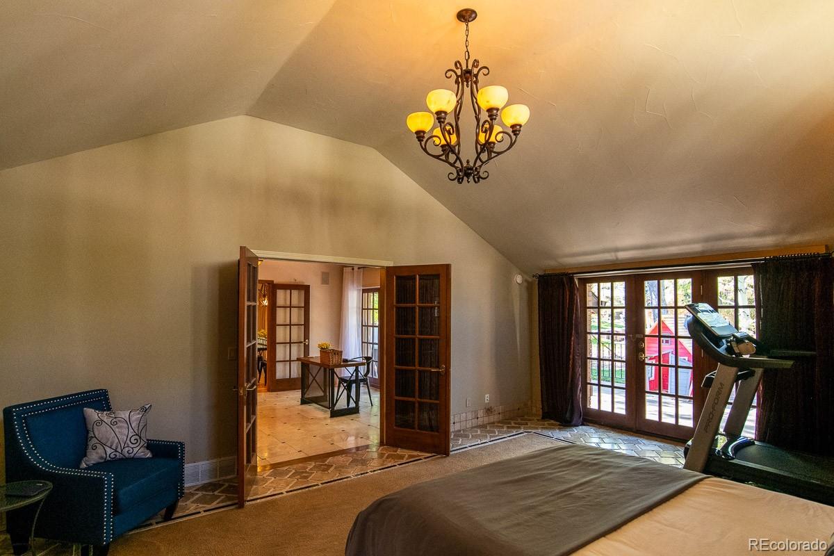 7181 Four Rivers Road Boulder, CO 80301 - Photo 17 of 35 a view of a livingroom with a chandelier