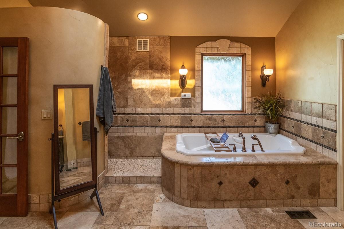 7181 Four Rivers Road Boulder, CO 80301 - Photo 20 of 35 a bathroom with a sink and a mirror