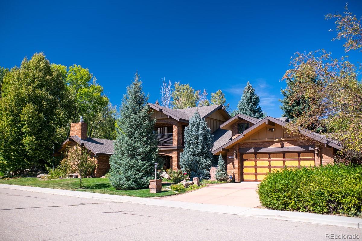 7181 Four Rivers Road Boulder, CO 80301 - Photo 2 of 35 a front view of a house with a yard