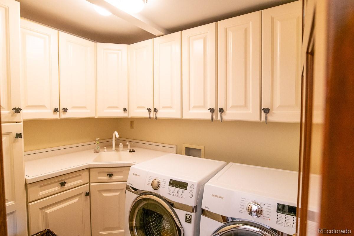 7181 Four Rivers Road Boulder, CO 80301 - Photo 23 of 35 a utility room with dryer and washer