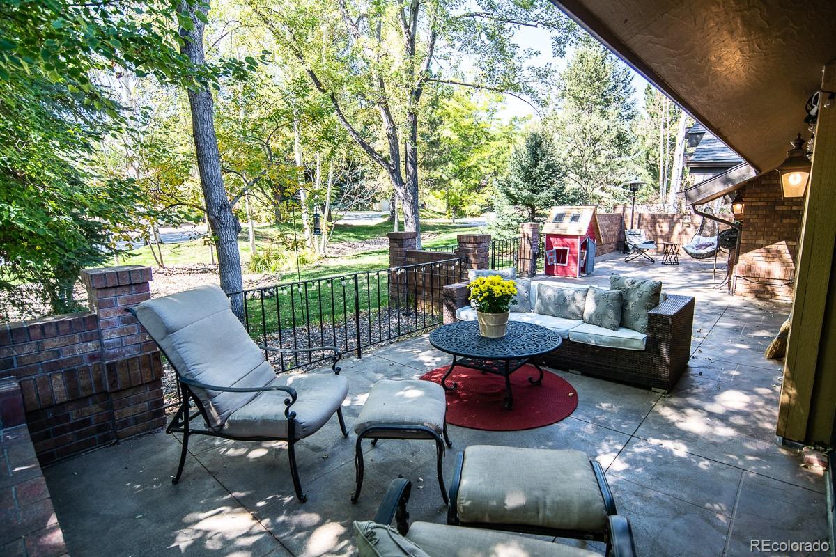 7181 Four Rivers Road Boulder, CO 80301 - Photo 28 of 35 a view of a patio with couches table and chairs and potted plants