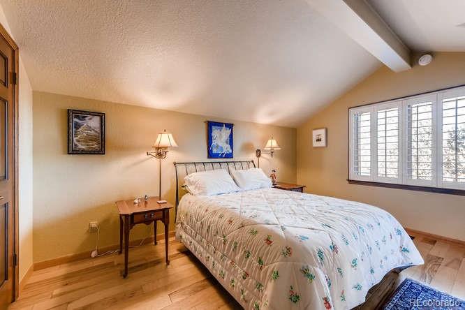 7181 Four Rivers Road Boulder, CO 80301 - Photo 31 of 35 a bedroom with a bed and a window