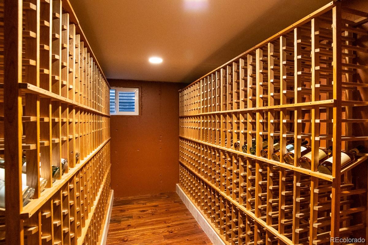 7181 Four Rivers Road Boulder, CO 80301 - Photo 32 of 35 a view of staircase with wooden floor and stairs