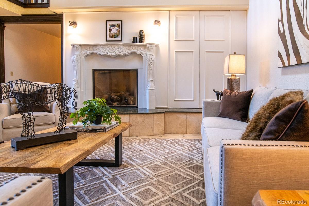 7181 Four Rivers Road Boulder, CO 80301 - Photo 5 of 35 a living room with furniture and a fireplace