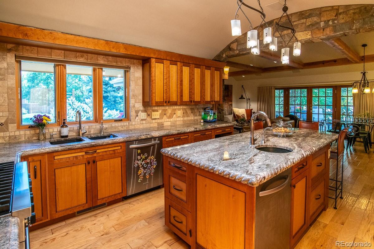 7181 Four Rivers Road Boulder, CO 80301 - Photo 6 of 35 a kitchen with stainless steel appliances granite countertop sink stove and refrigerator
