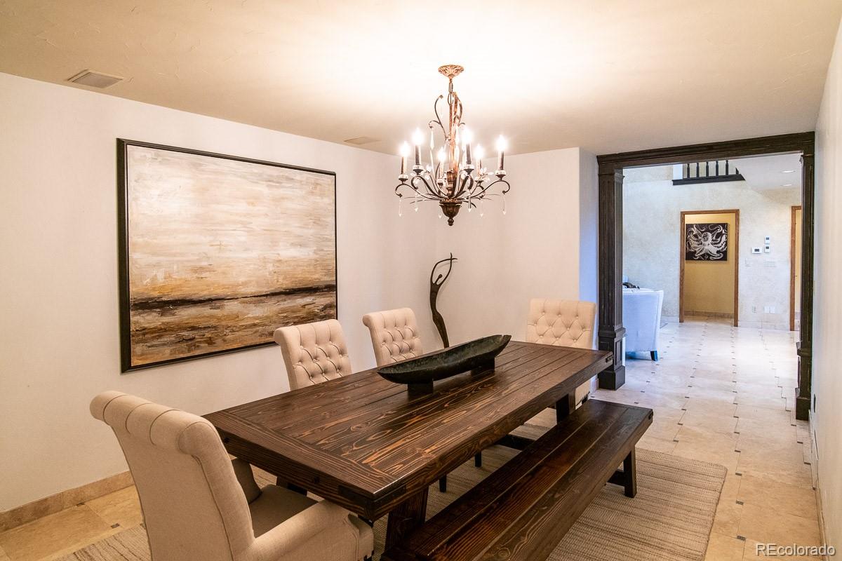 7181 Four Rivers Road Boulder, CO 80301 - Photo 9 of 35 a living room with furniture and a flat screen tv