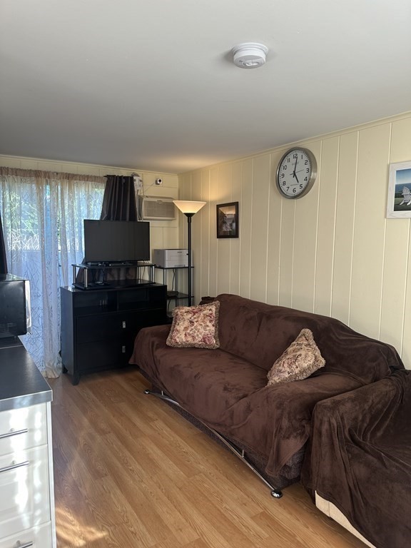 174 Captain Chase Road, Unit 9 Dennis, MA 02639 - Photo 8 of 23 a living room with furniture and a flat screen tv