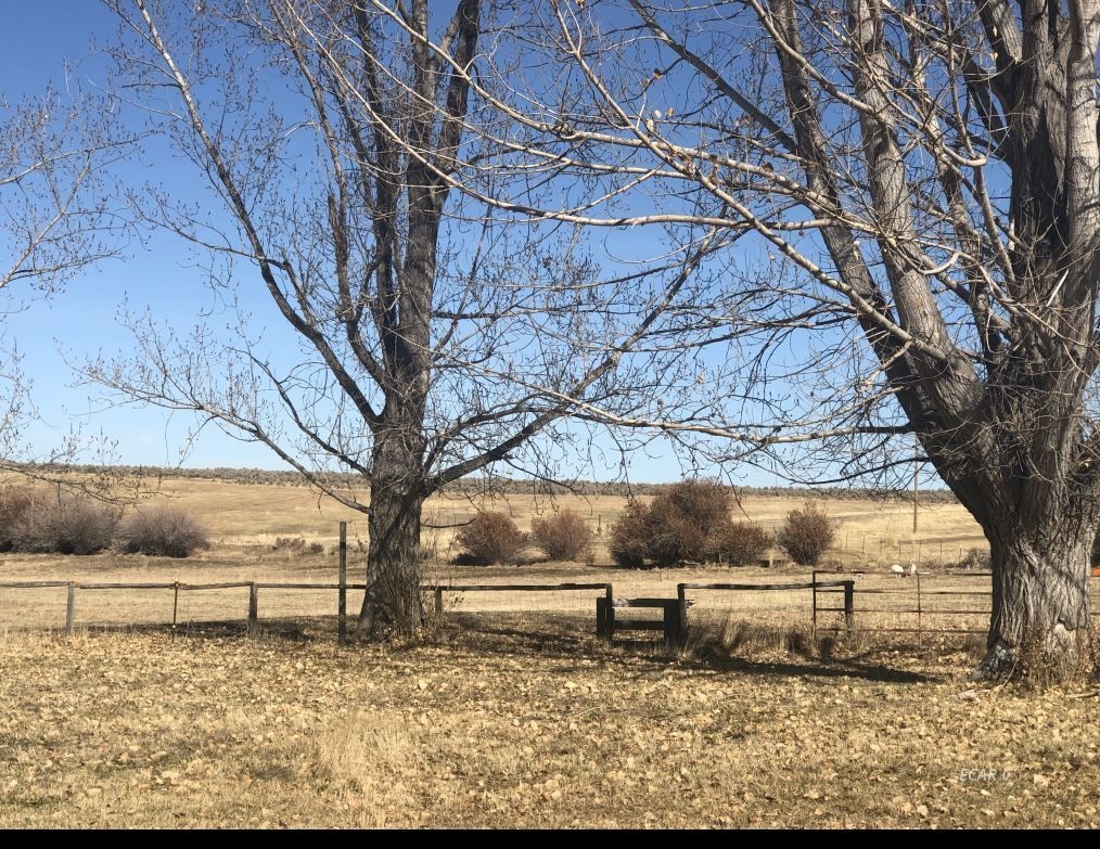 4068 Starr Valley Road Deeth, NV 89823 - Photo 7 of 18 a view of a yard covered with snow in the yard
