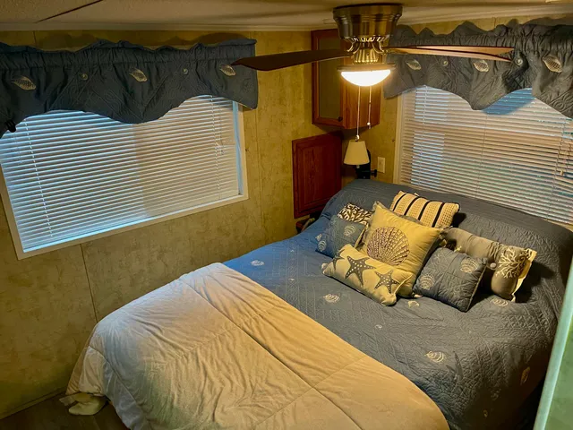 a bedroom with a bed and a walk in closet