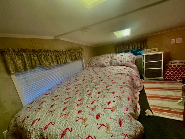 a bathroom with a sink a mirror and a shower