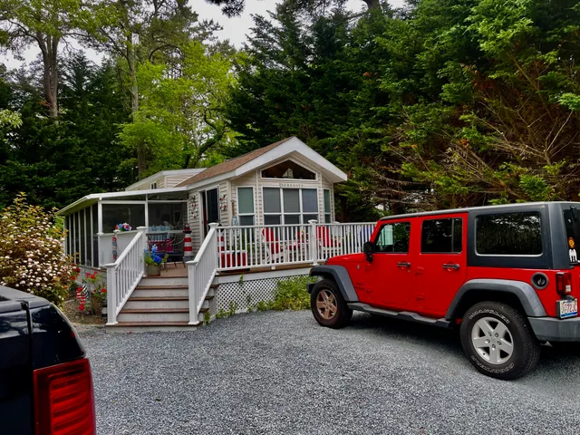 a front view of a house with parking space