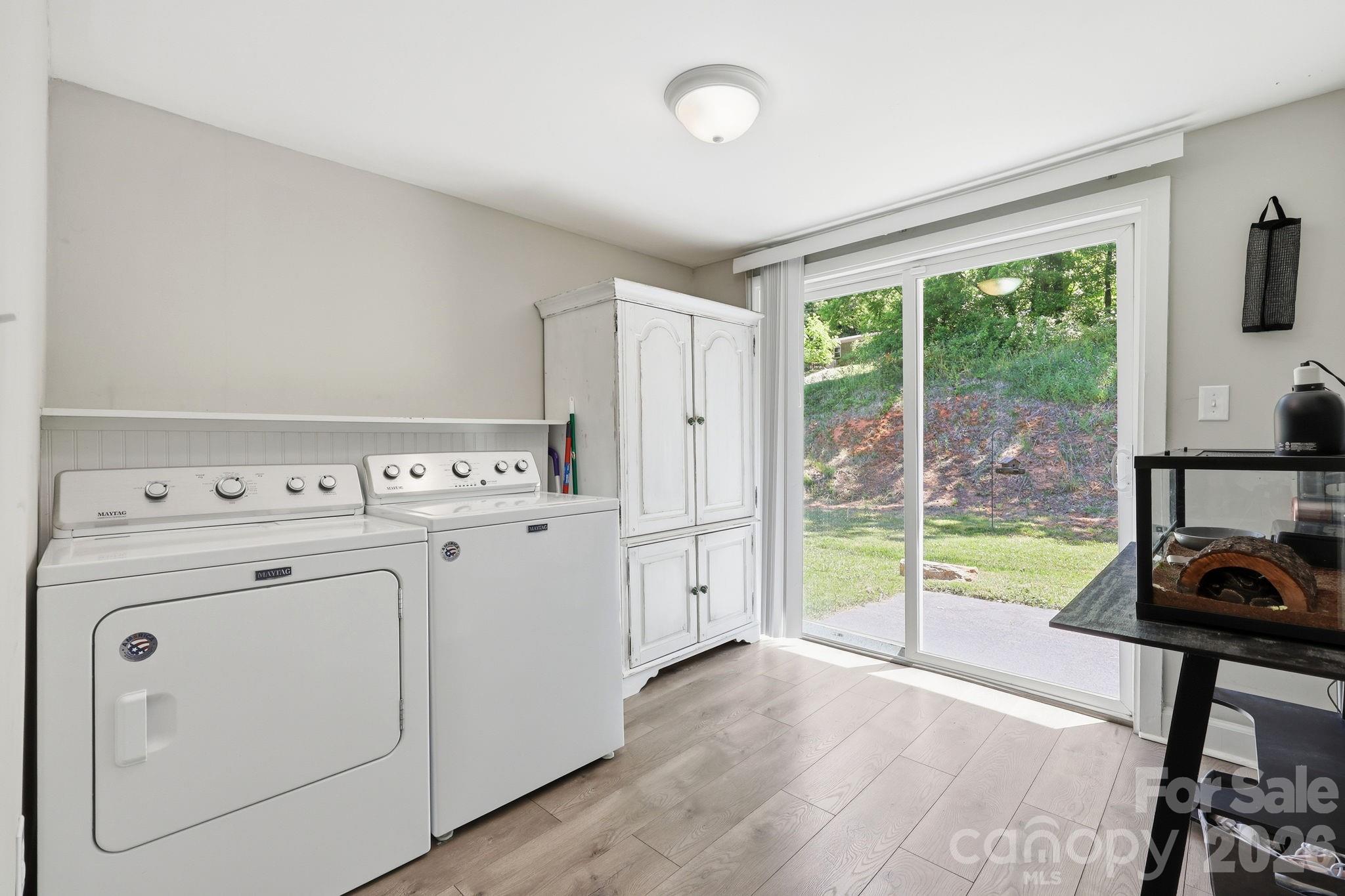197 Mulberry Street Clyde, NC 28721 - Photo 21 of 31 a view of storage and utility room with washer and dryer