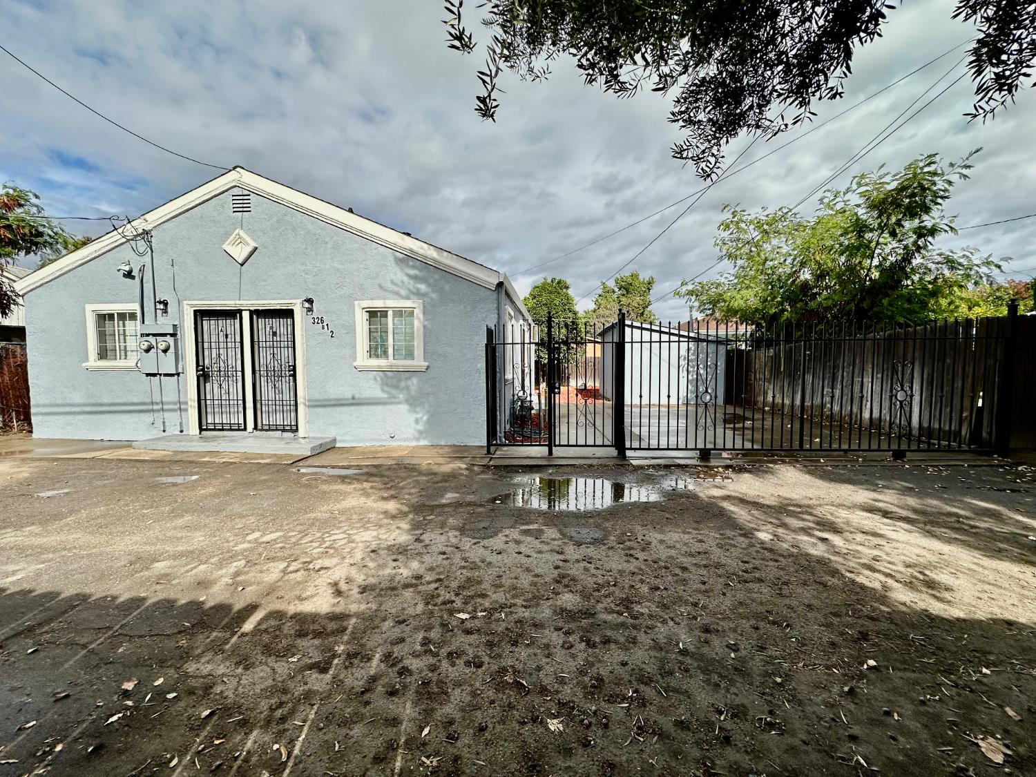 326 Eden Street Lodi, CA 95240 - Photo 1 of 1 a front view of a house with a yard