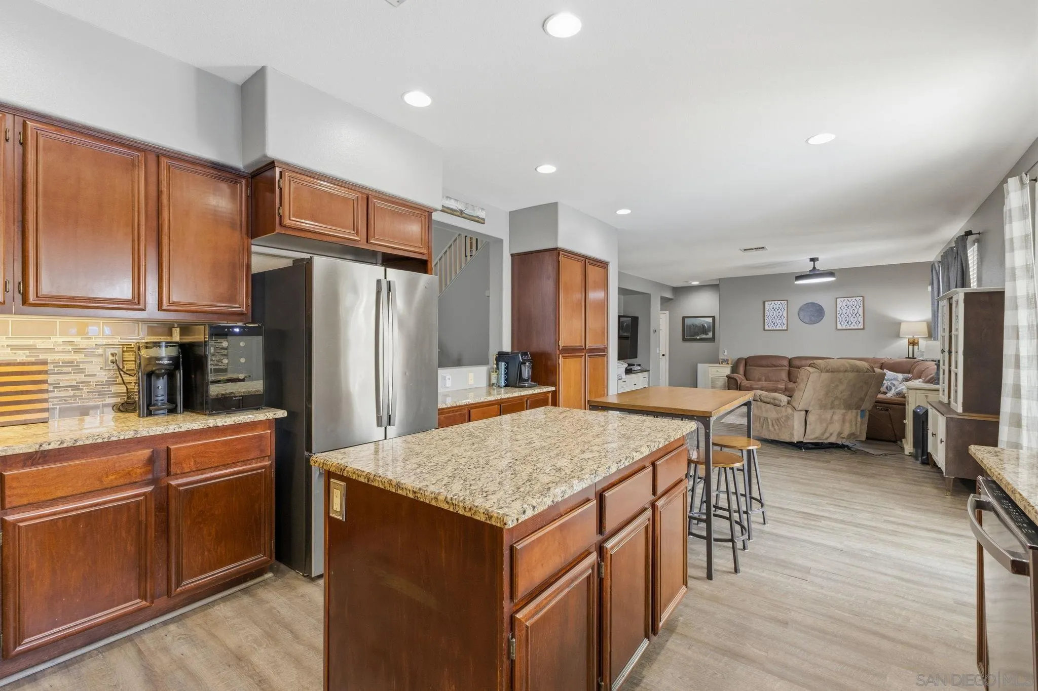 31342 Euclid Loop Winchester, CA 92596 - Photo 20 of 50 a kitchen with sink refrigerator and cabinets