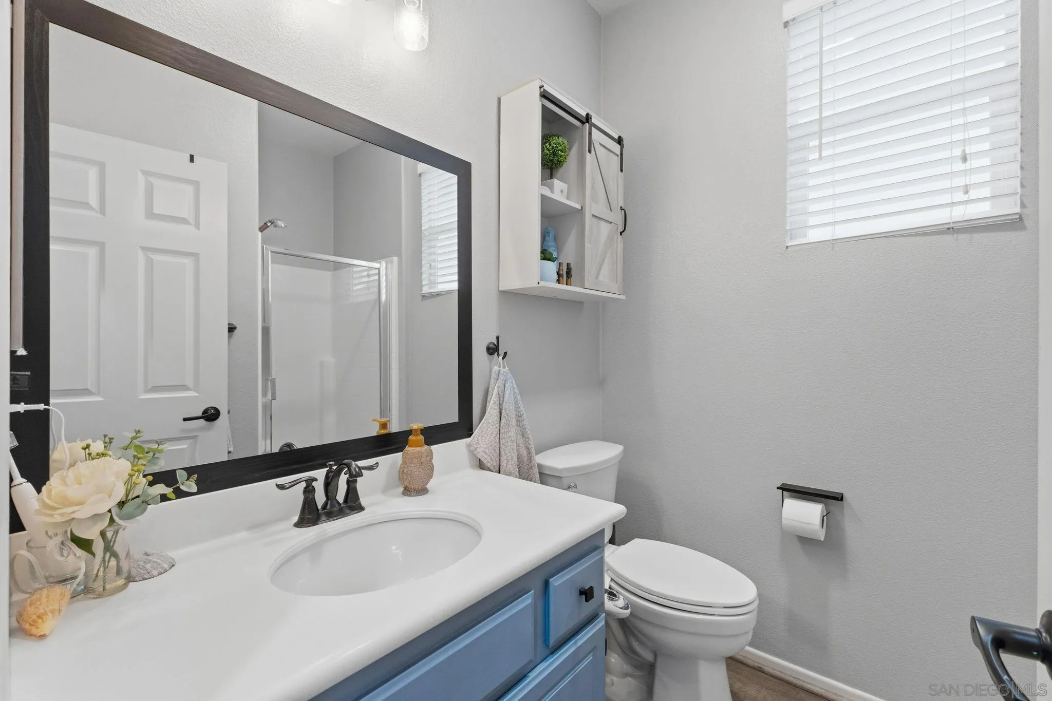 31342 Euclid Loop Winchester, CA 92596 - Photo 23 of 50 a bathroom with a toilet sink and mirror