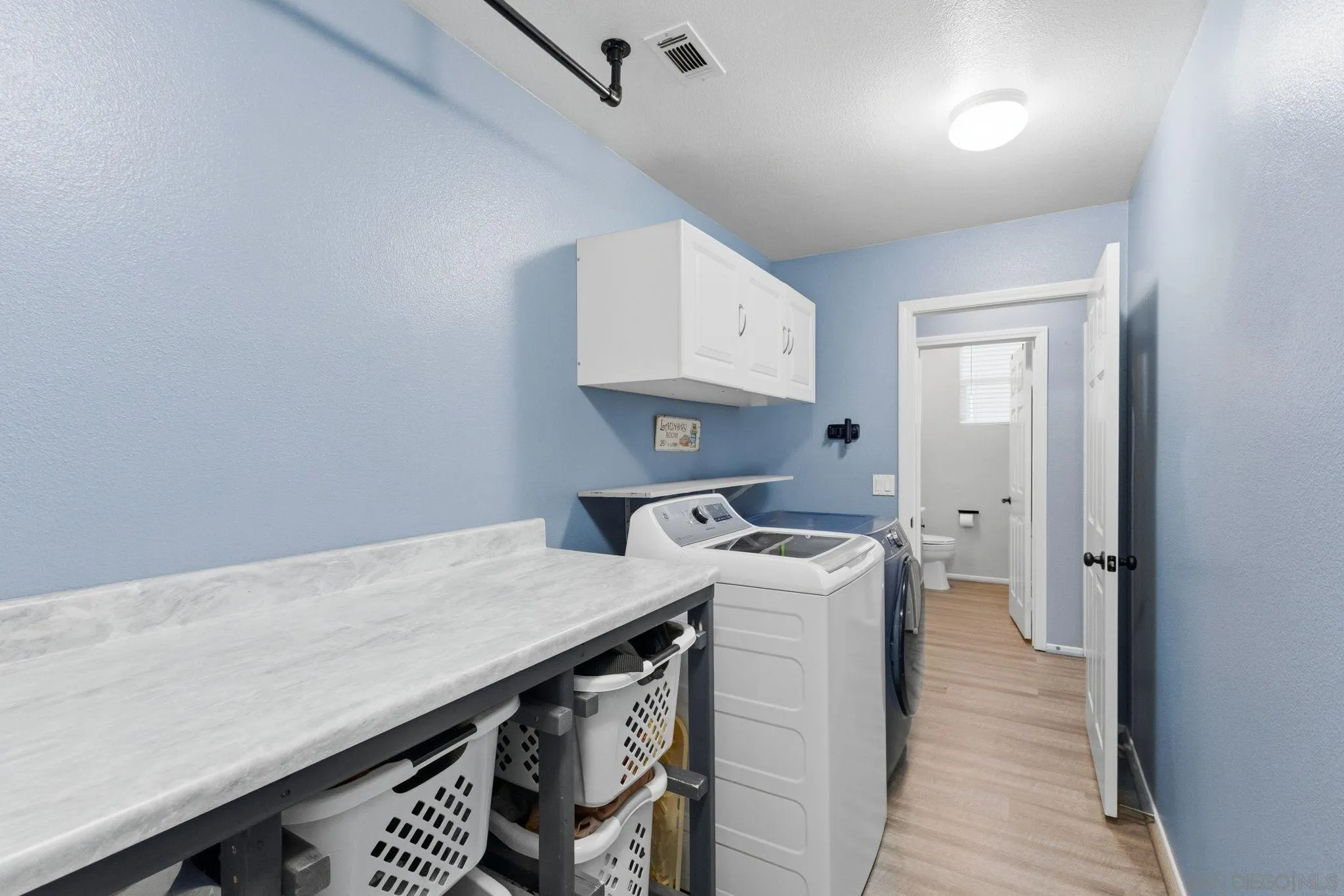 31342 Euclid Loop Winchester, CA 92596 - Photo 25 of 50 a room with storage and utility