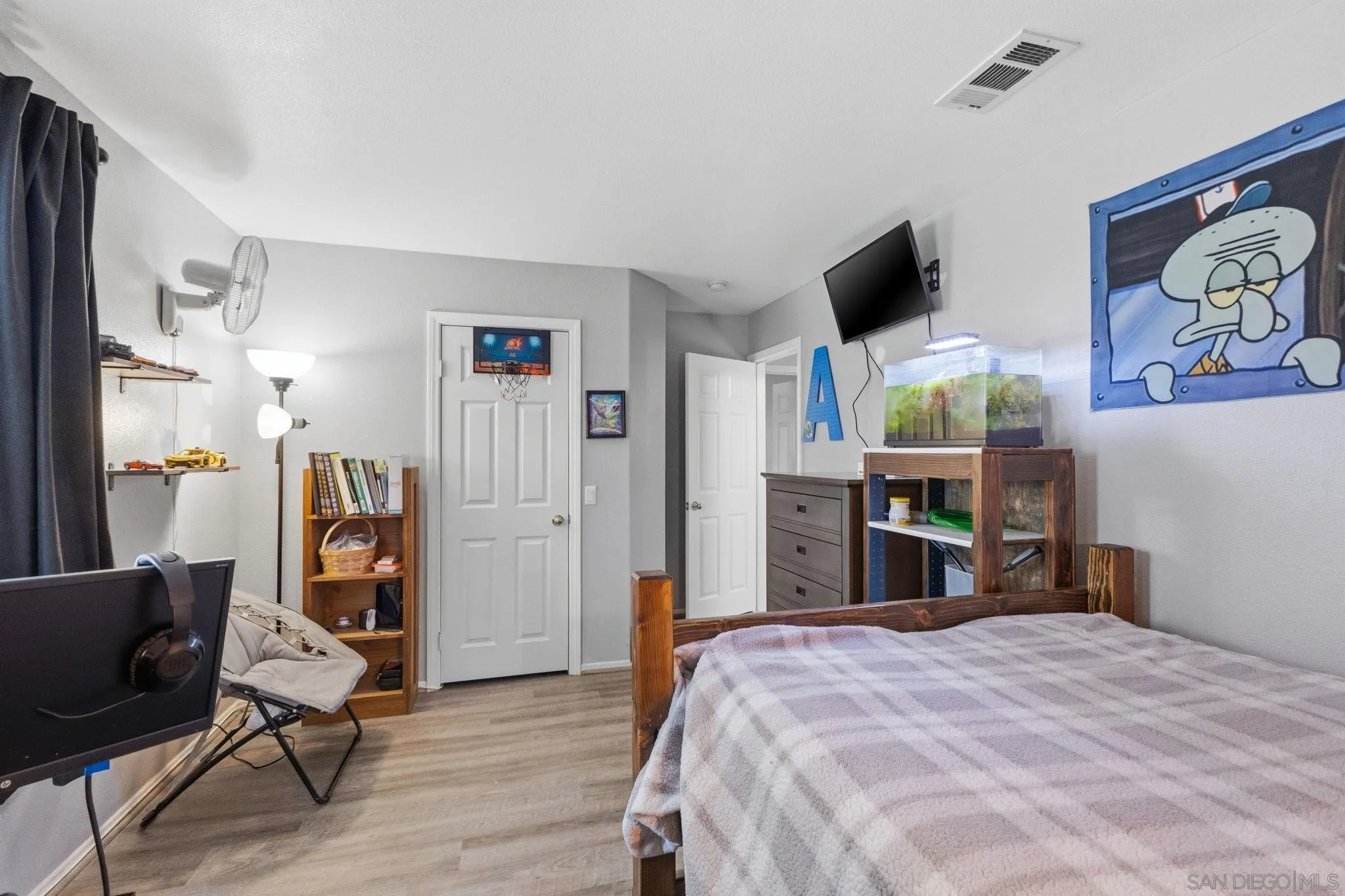 31342 Euclid Loop Winchester, CA 92596 - Photo 27 of 50 a bed room with a bed and a flat screen tv