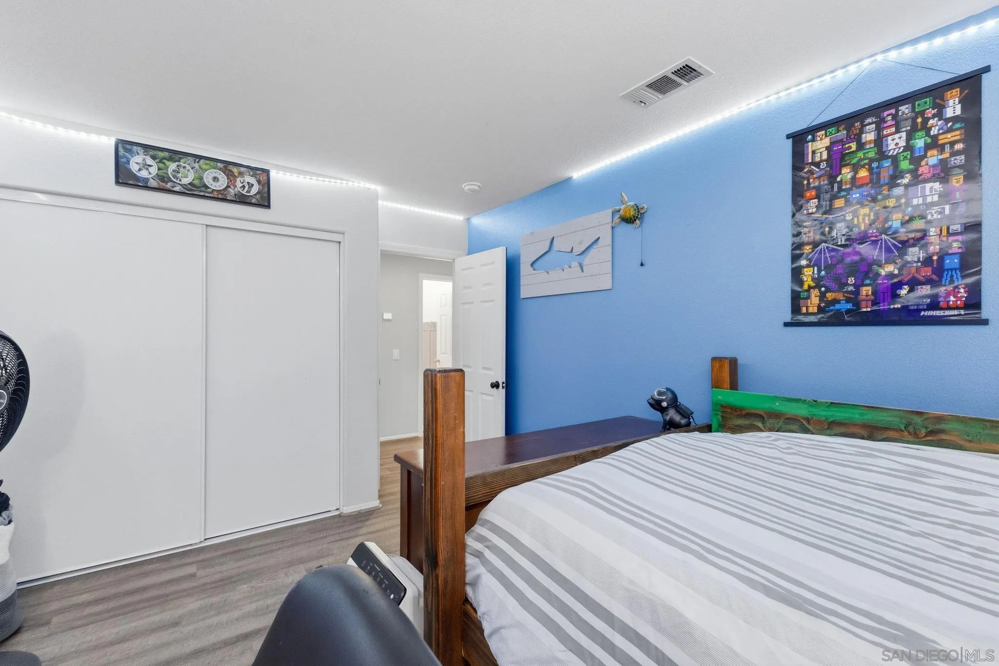 31342 Euclid Loop Winchester, CA 92596 - Photo 30 of 50 a bedroom with a bed and a painting on the wall