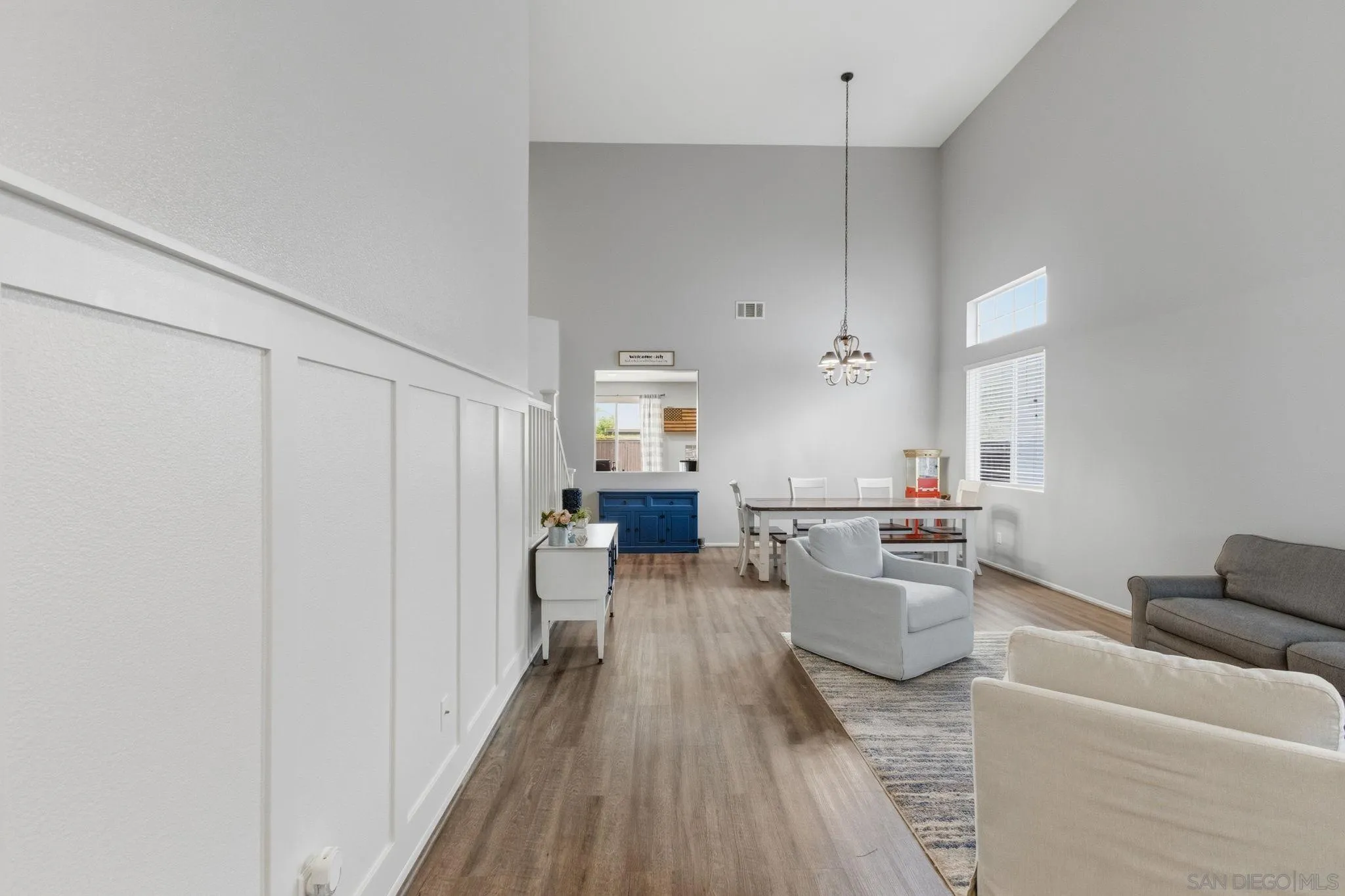 31342 Euclid Loop Winchester, CA 92596 - Photo 3 of 50 a view of a living room hardwood floor and a kitchen