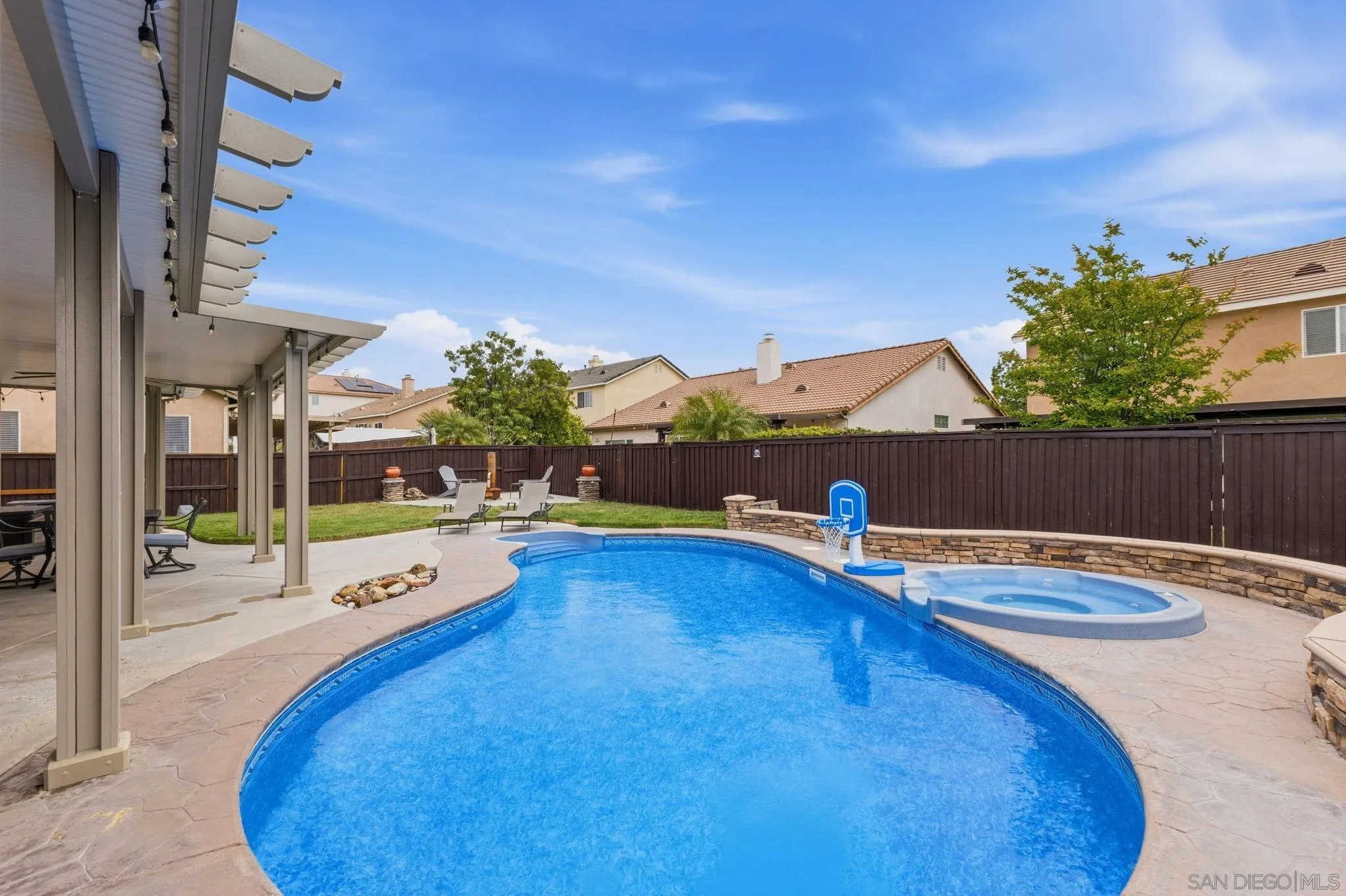 31342 Euclid Loop Winchester, CA 92596 - Photo 43 of 50 a view of a swimming pool with an outdoor seating