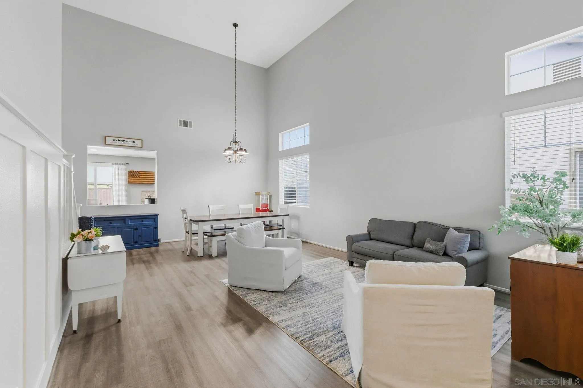 31342 Euclid Loop Winchester, CA 92596 - Photo 10 of 50 a living room with furniture and a large window