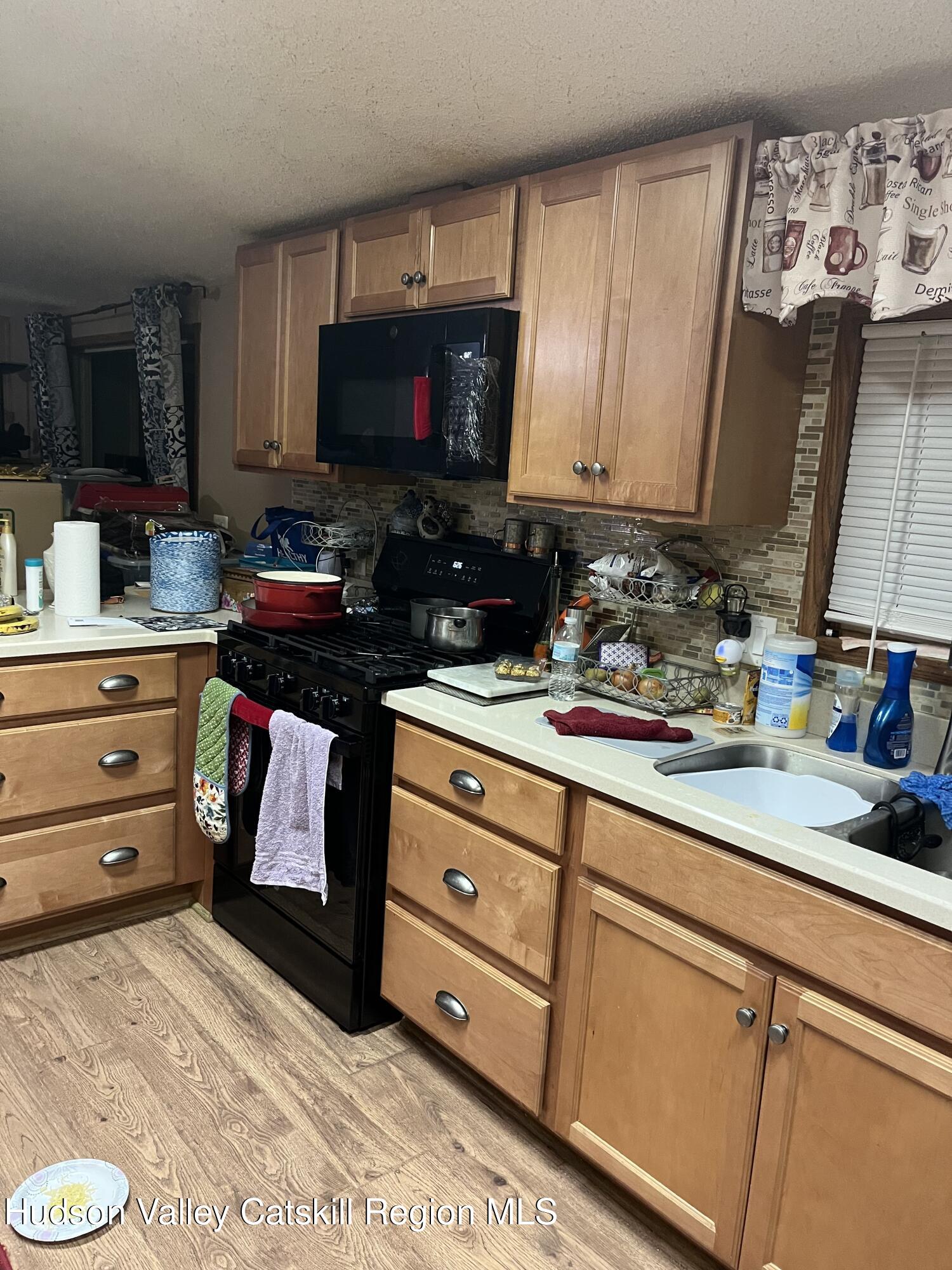 552 Travis Hill Road Rensselaerville, NY 12469 - Photo 11 of 11 a kitchen with appliances a sink and cabinets