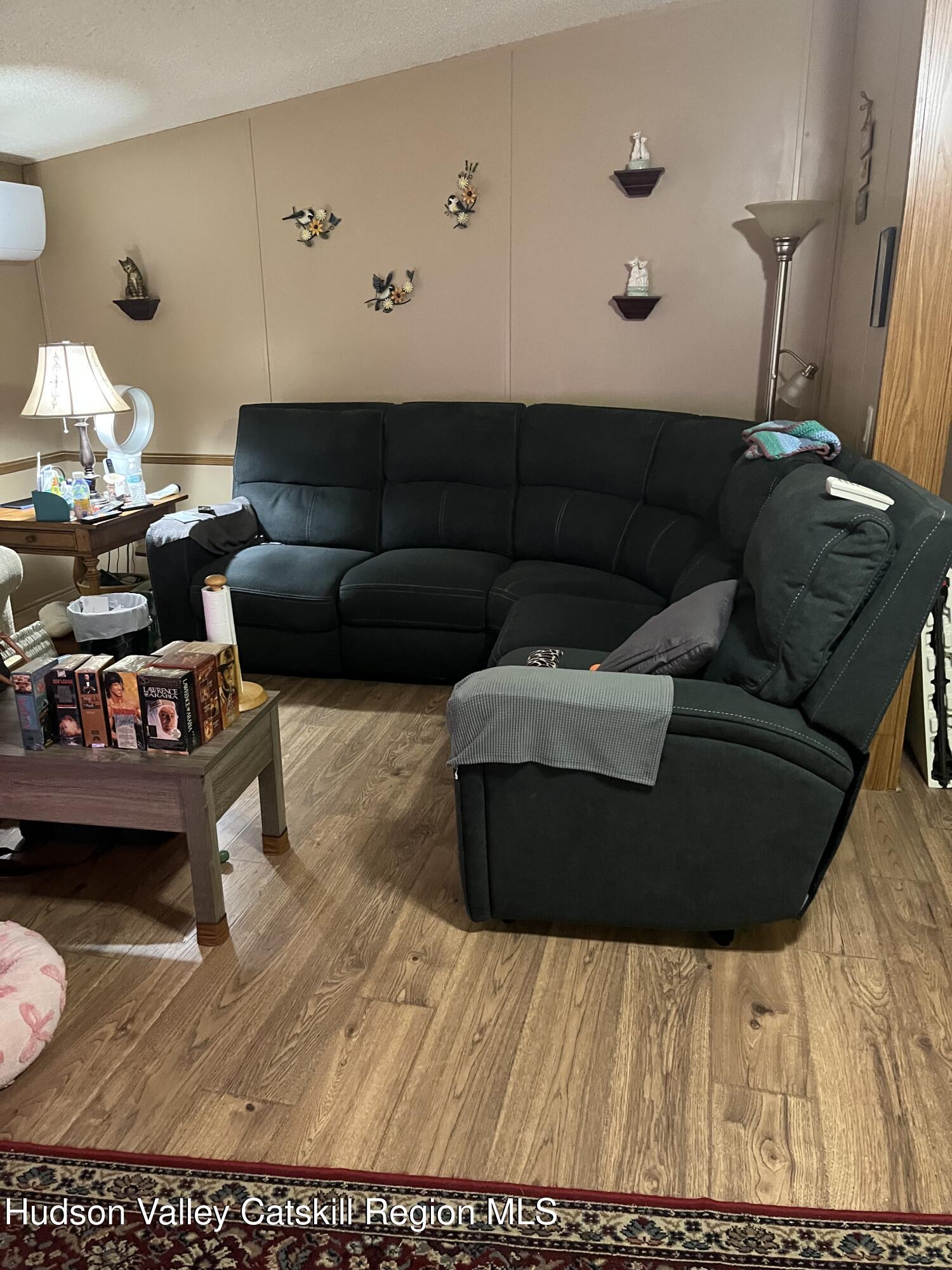 552 Travis Hill Road Rensselaerville, NY 12469 - Photo 9 of 11 a living room with furniture and a couch