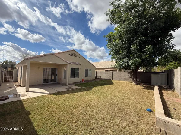 a view of a backyard of the house