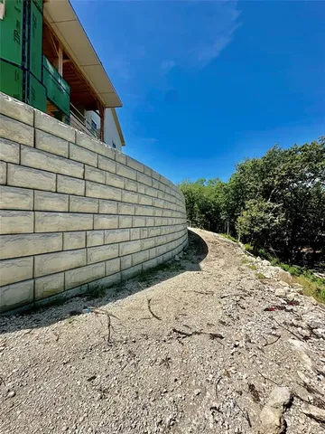 a view of a room with wooden floor and windows