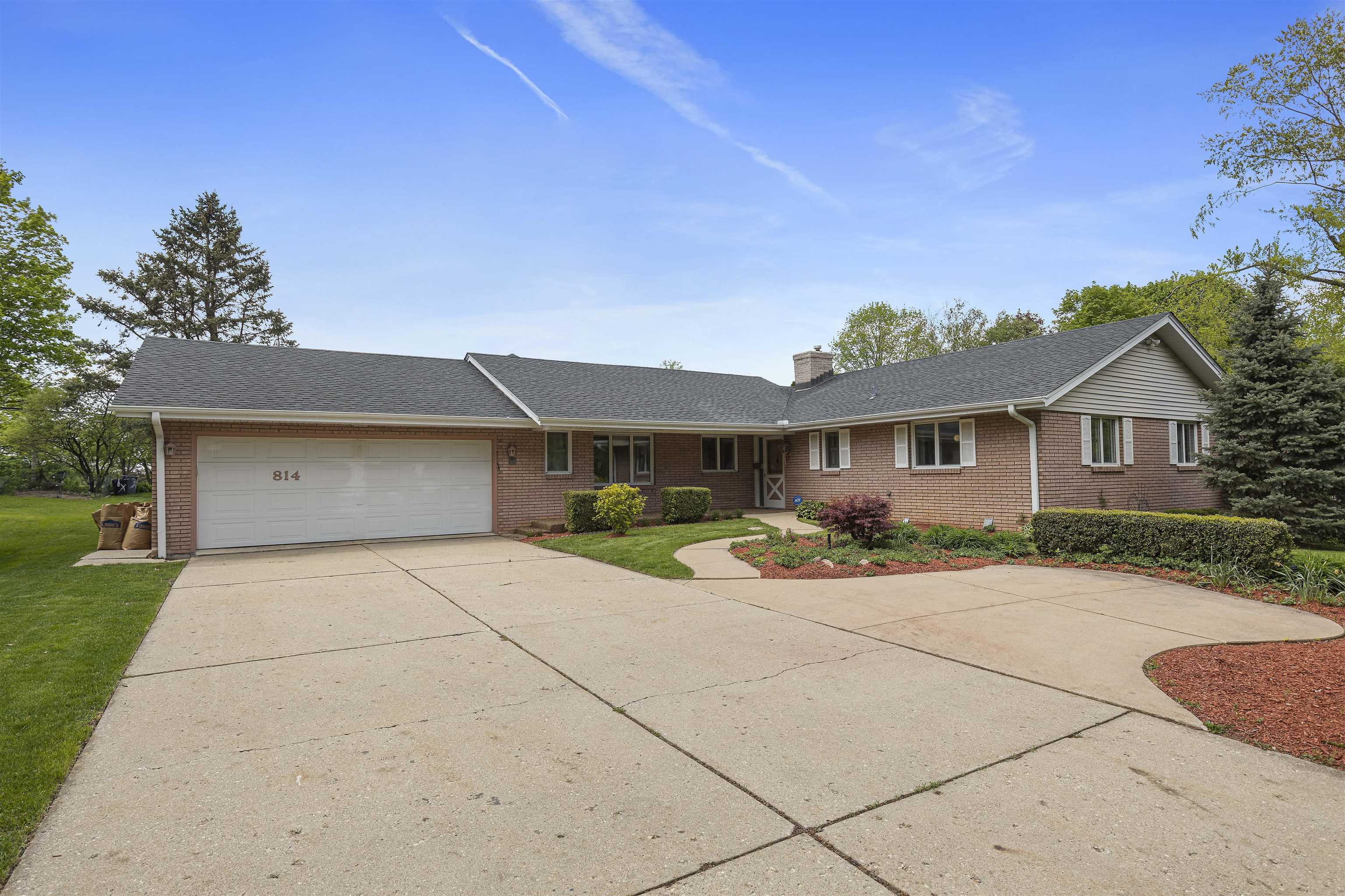 814 Roxbury Road Rockford, IL 61107 - Photo 1 of 36 a front view of a house with yard and green space