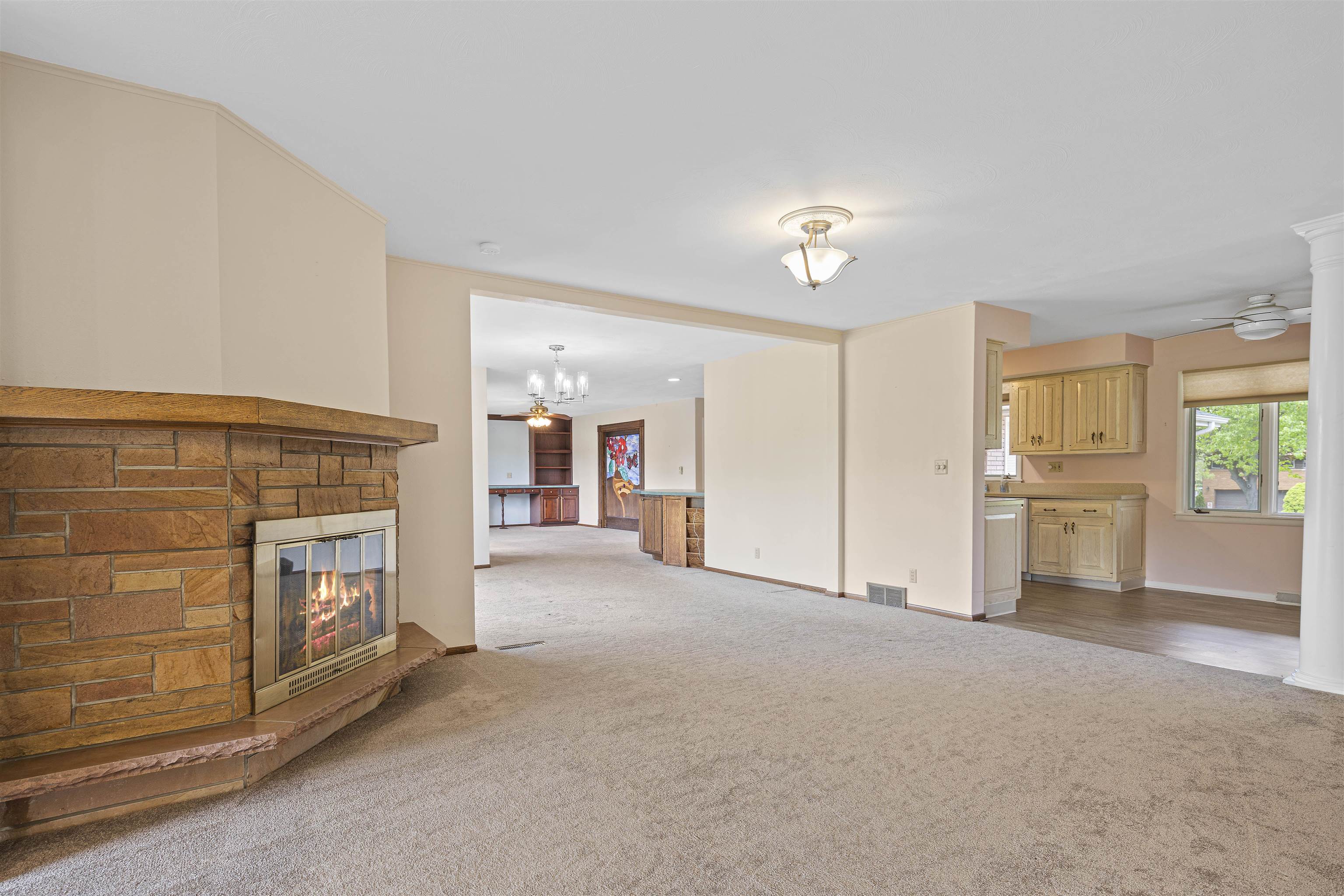 814 Roxbury Road Rockford, IL 61107 - Photo 12 of 36 a view of a livingroom with an empty space and a fireplace