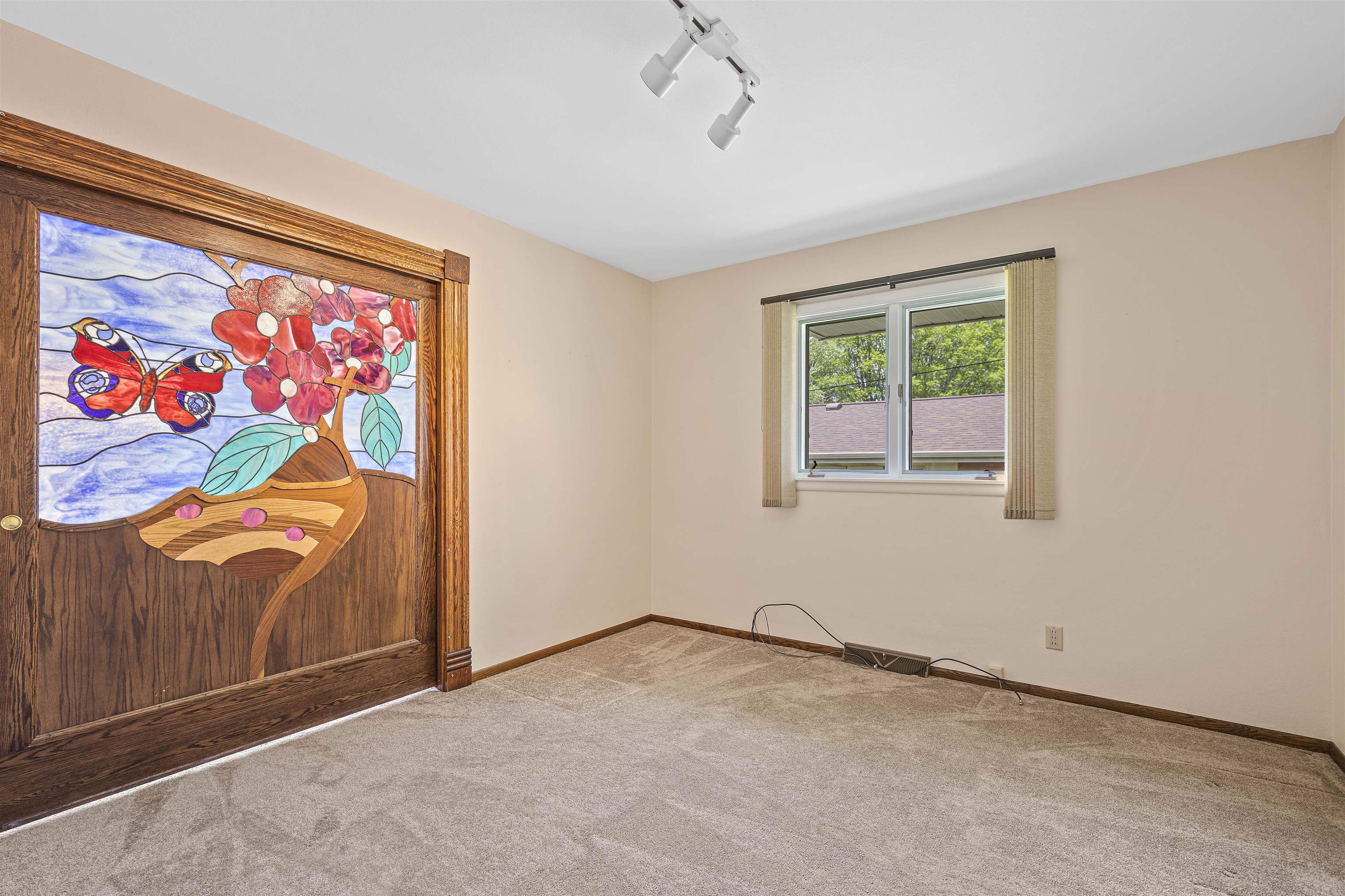 814 Roxbury Road Rockford, IL 61107 - Photo 23 of 36 an empty room with windows ceiling fan and window