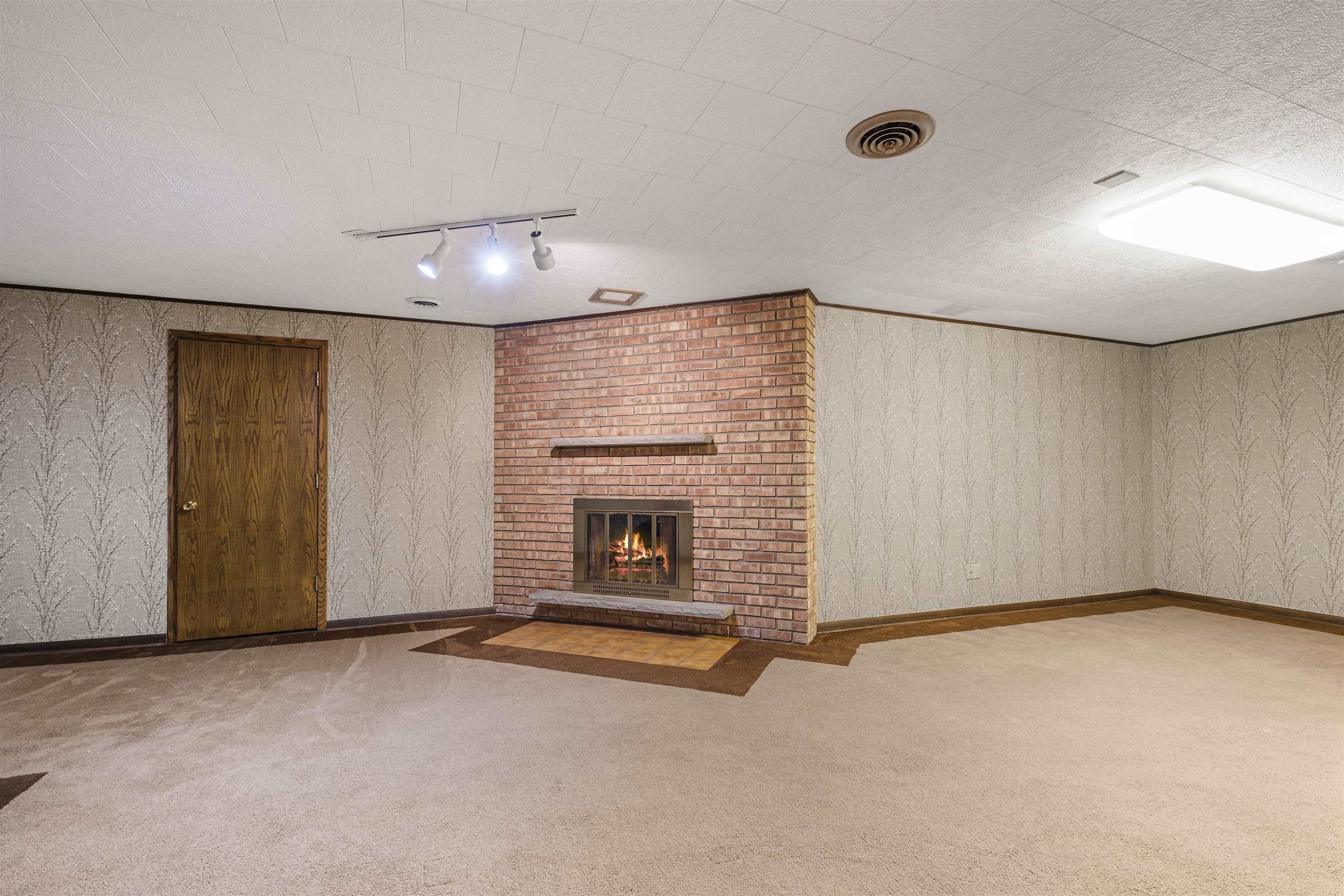 814 Roxbury Road Rockford, IL 61107 - Photo 26 of 36 a view of an empty room with a fireplace