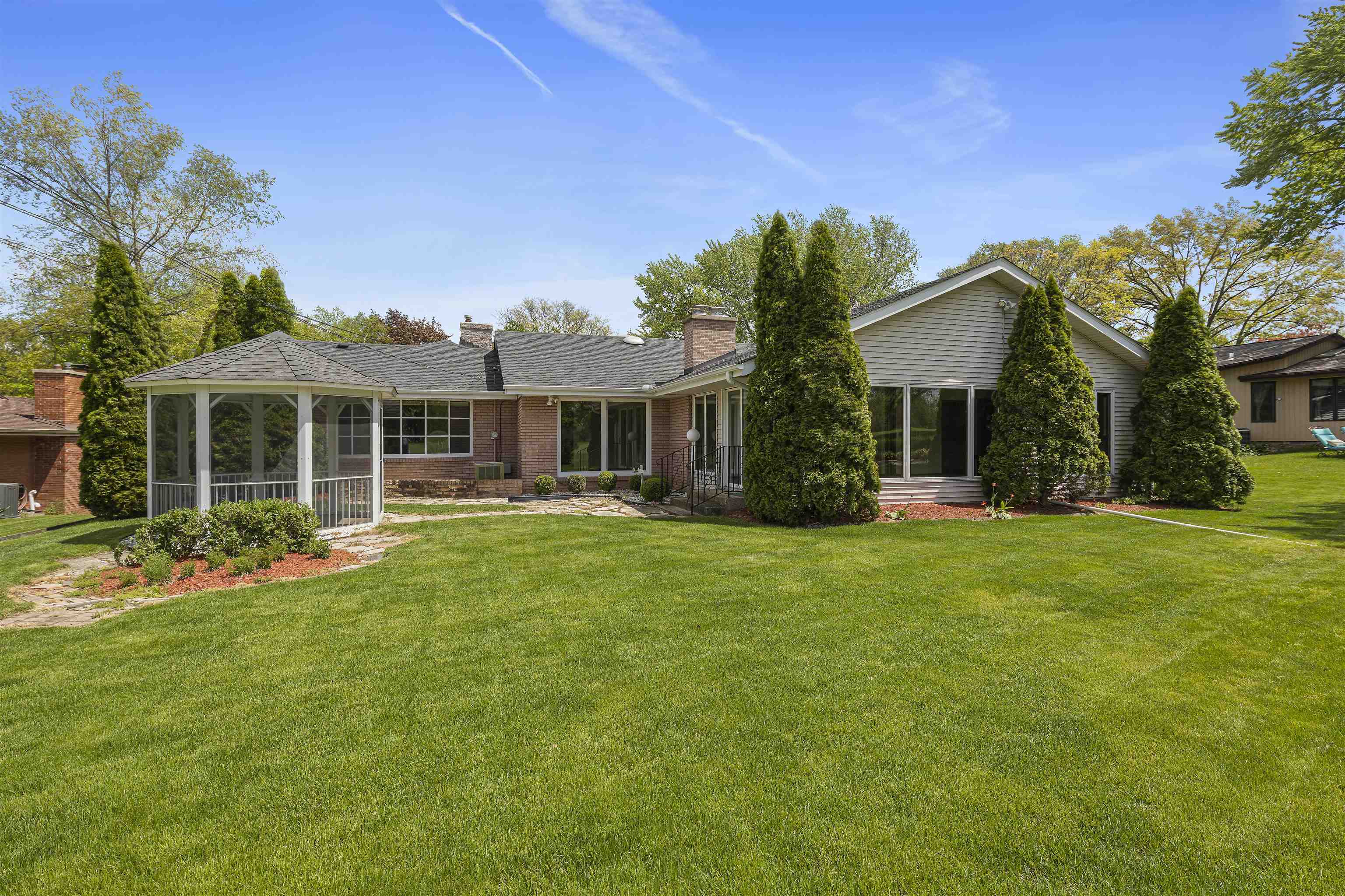 814 Roxbury Road Rockford, IL 61107 - Photo 31 of 36 a front view of a house with a garden