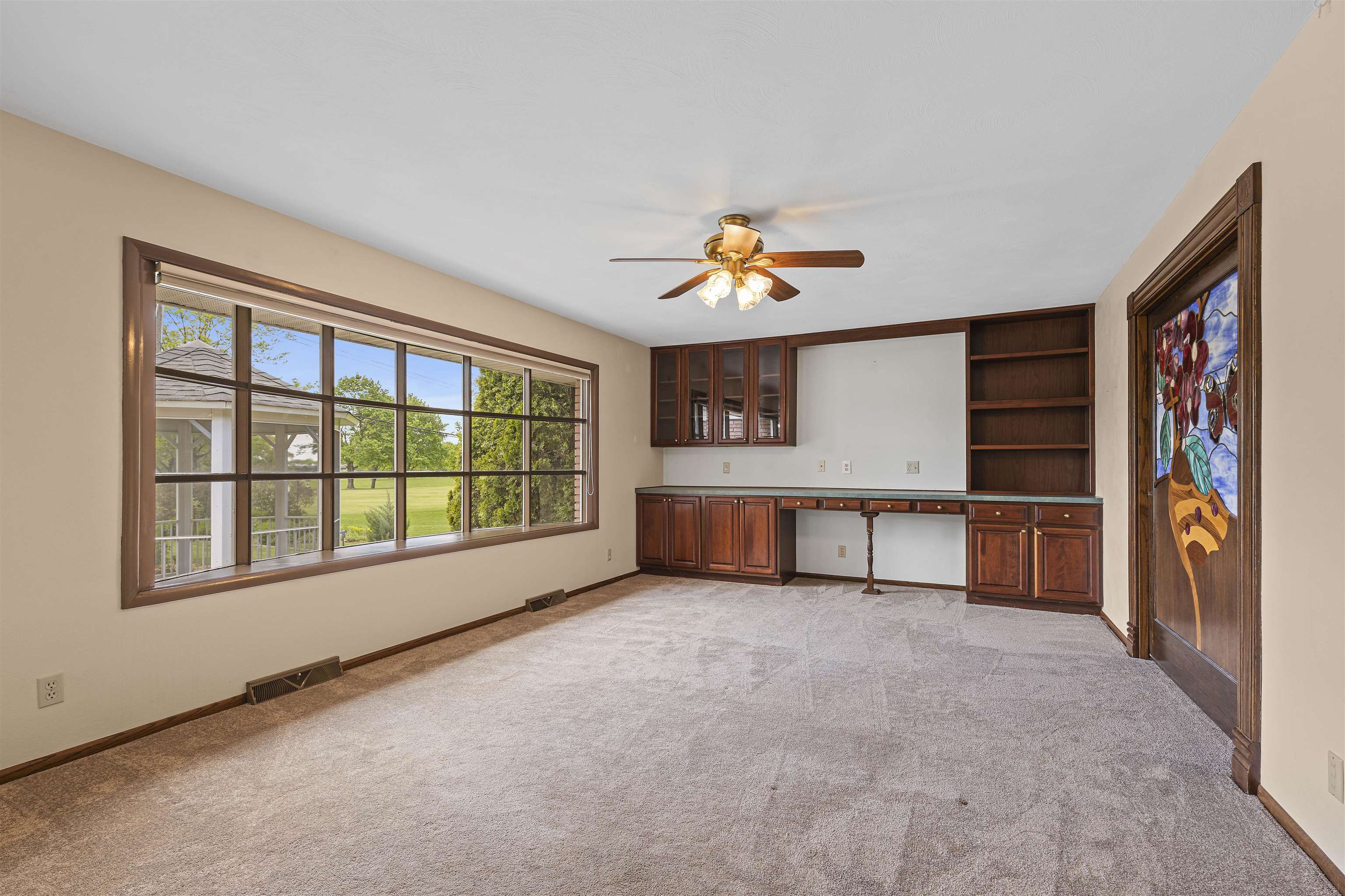 814 Roxbury Road Rockford, IL 61107 - Photo 4 of 36 a view of an empty room with a window