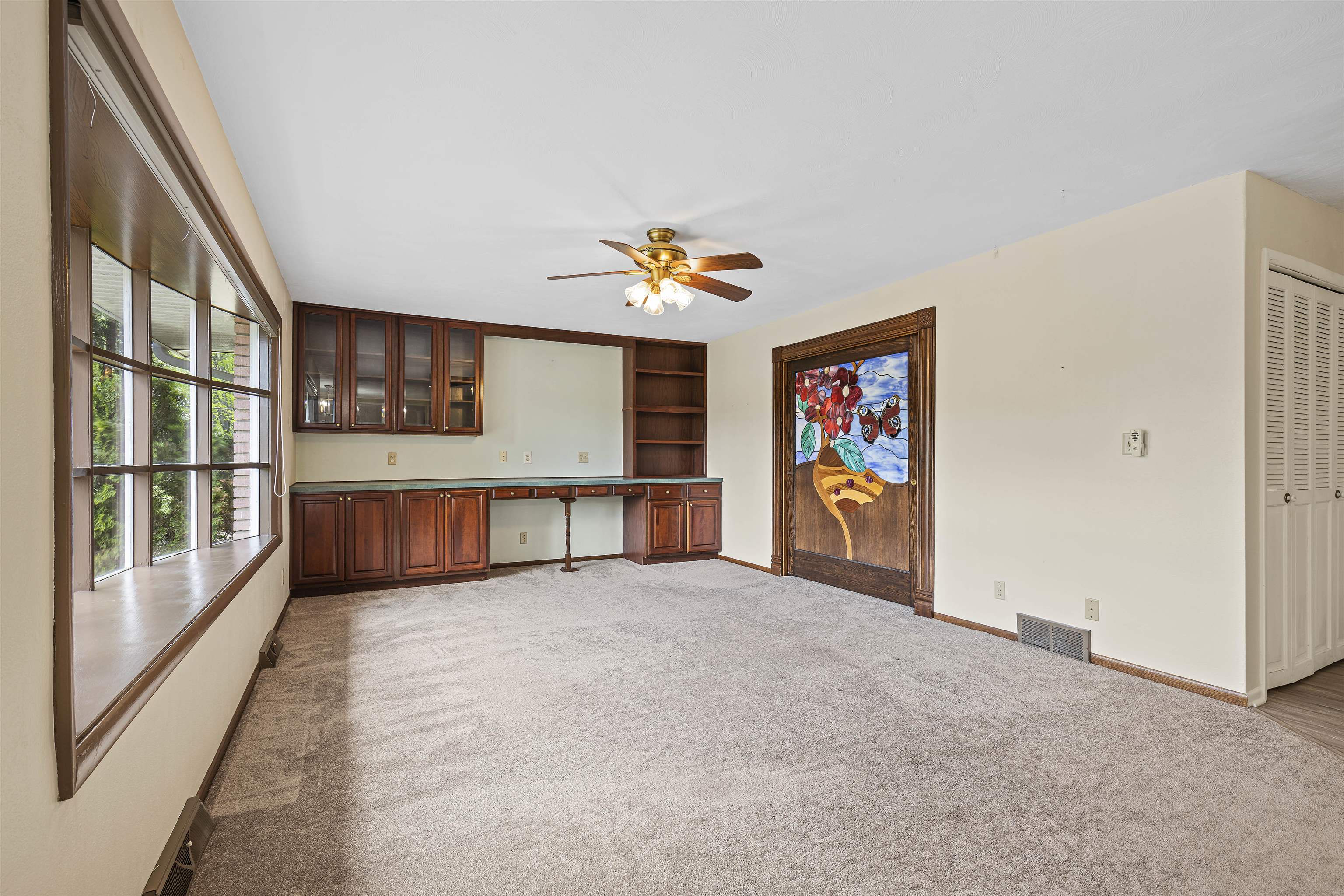 814 Roxbury Road Rockford, IL 61107 - Photo 5 of 36 a view of an empty room with a window