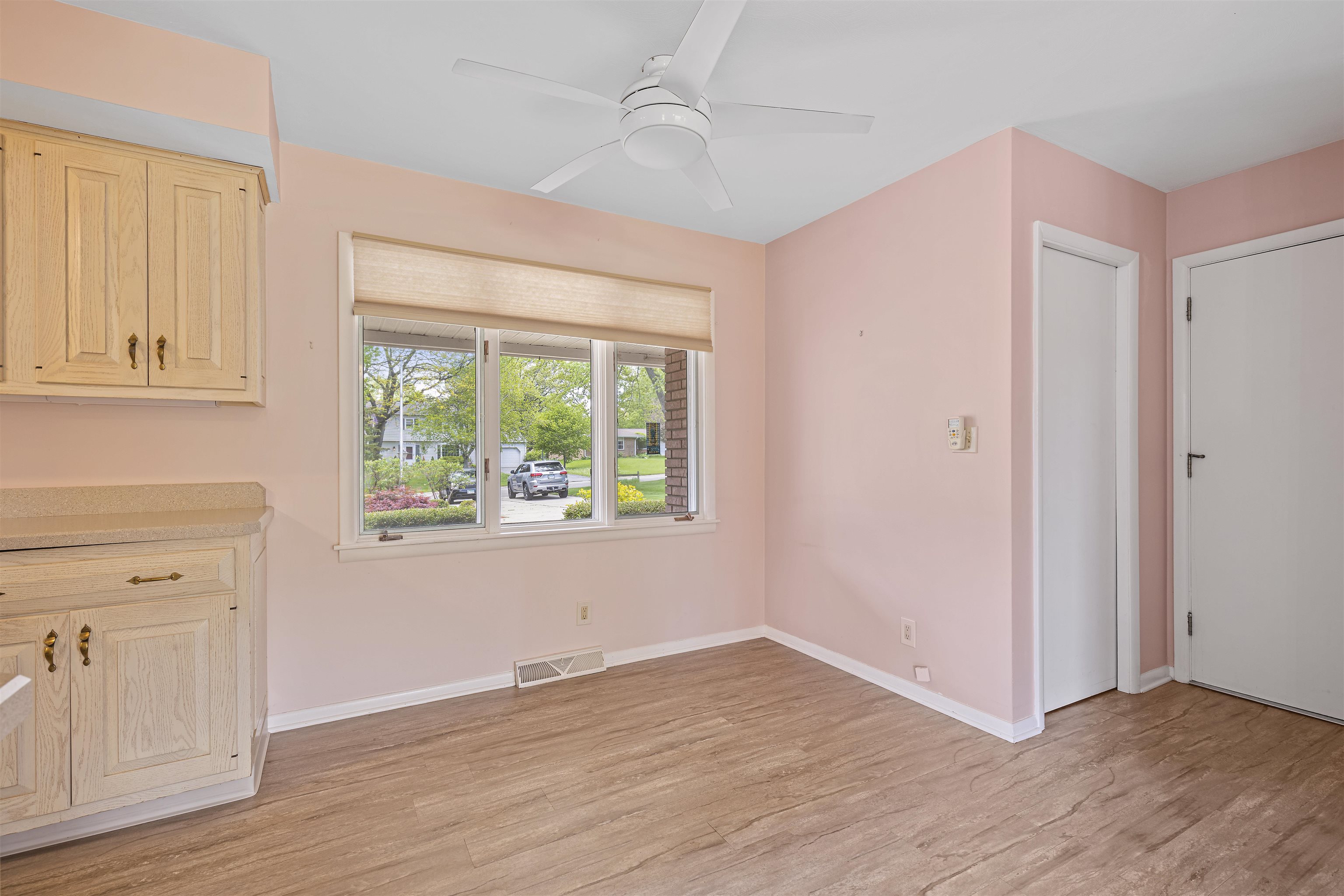 814 Roxbury Road Rockford, IL 61107 - Photo 9 of 36 an empty room with wooden floor and windows