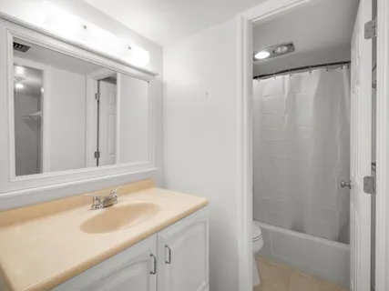 a bathroom with a sink and a shower