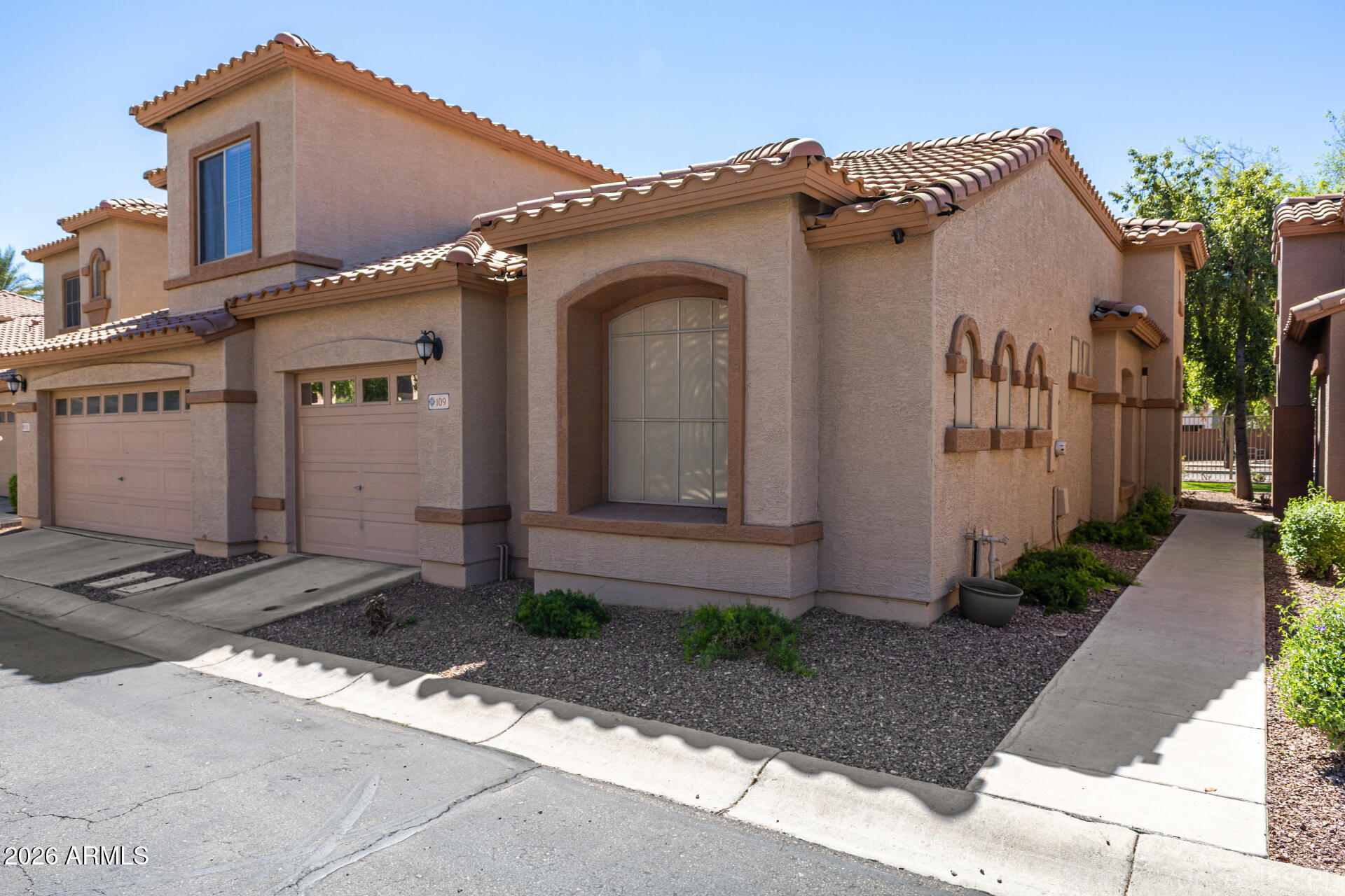 2600 East Springfield Place, Unit 109 Chandler, AZ 85286 - Photo 2 of 38 a front view of a house
