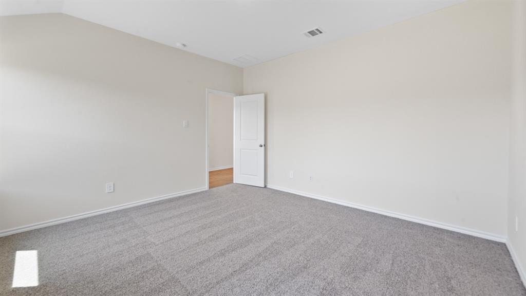 657 Glee Stem Road Lavon, TX 75166 - Photo 15 of 26 Spacious room featuring light gray carpeting, neutral wall finishes, and white trim