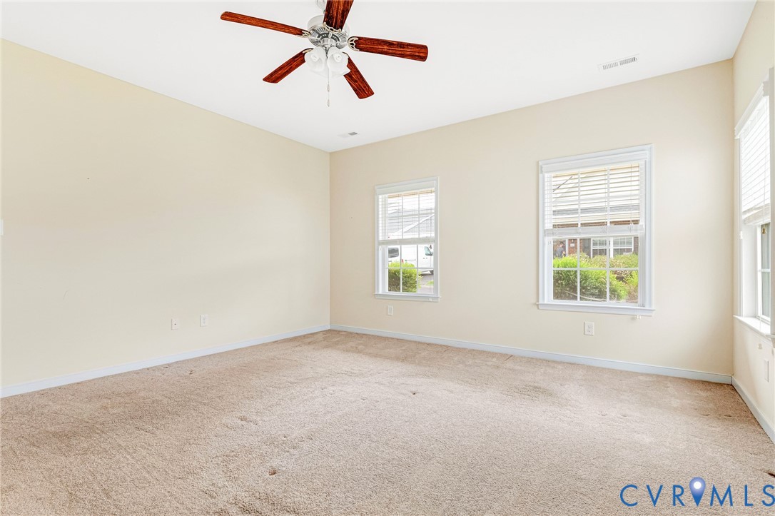 8996 Brigadier Road, Unit 4A Mechanicsville, VA 23116 - Photo 27 of 35 an empty room with windows and fan
