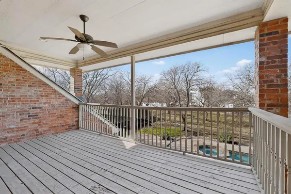 a view of balcony with wooden floor