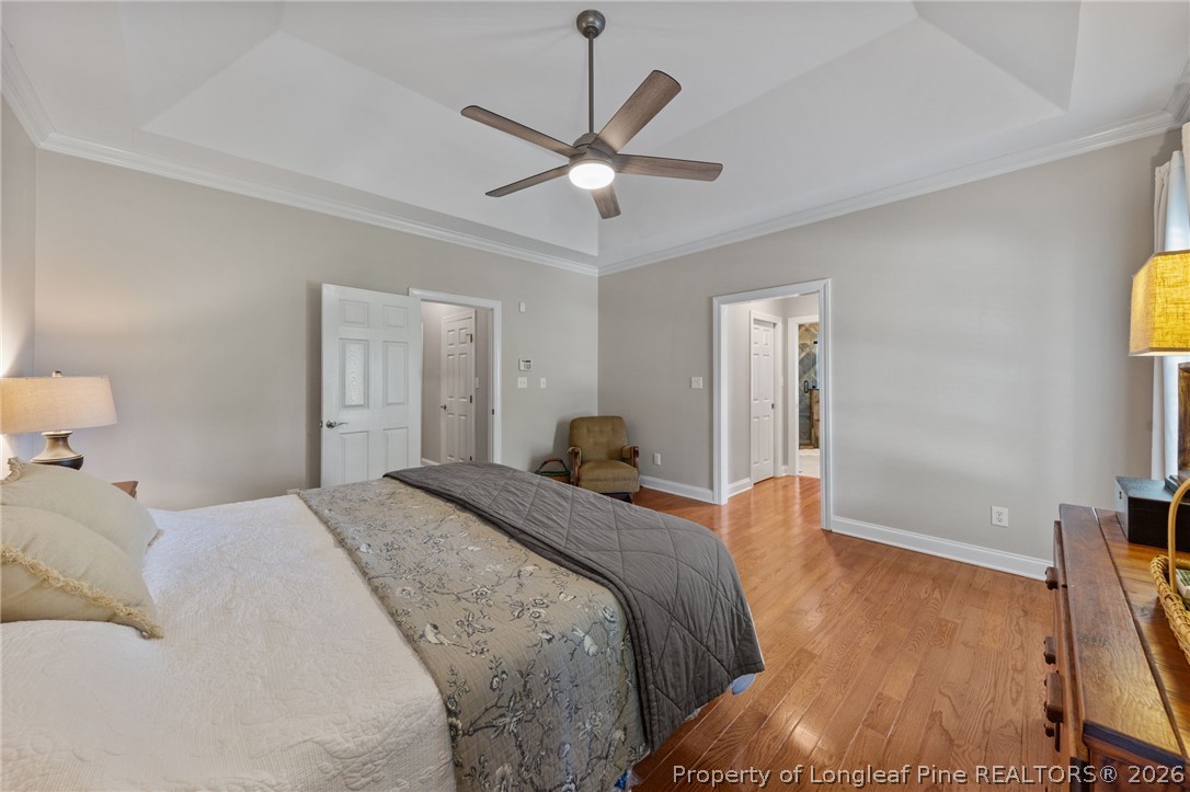 30180 East Lake Road Wagram, NC 28396 - Photo 27 of 42 a bed room with a bed and a ceiling fan