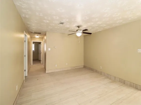 a kitchen with a refrigerator and a stove