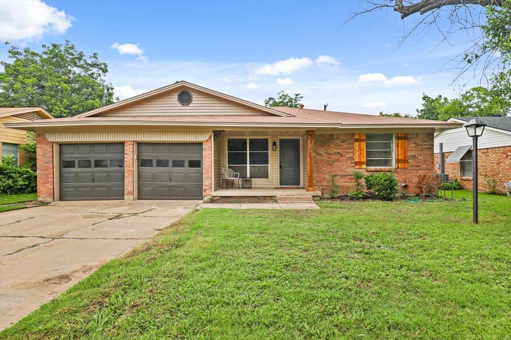 1716 Cordell Street Denton, TX 76201 - Photo 1 of 18 a front view of a house with garden
