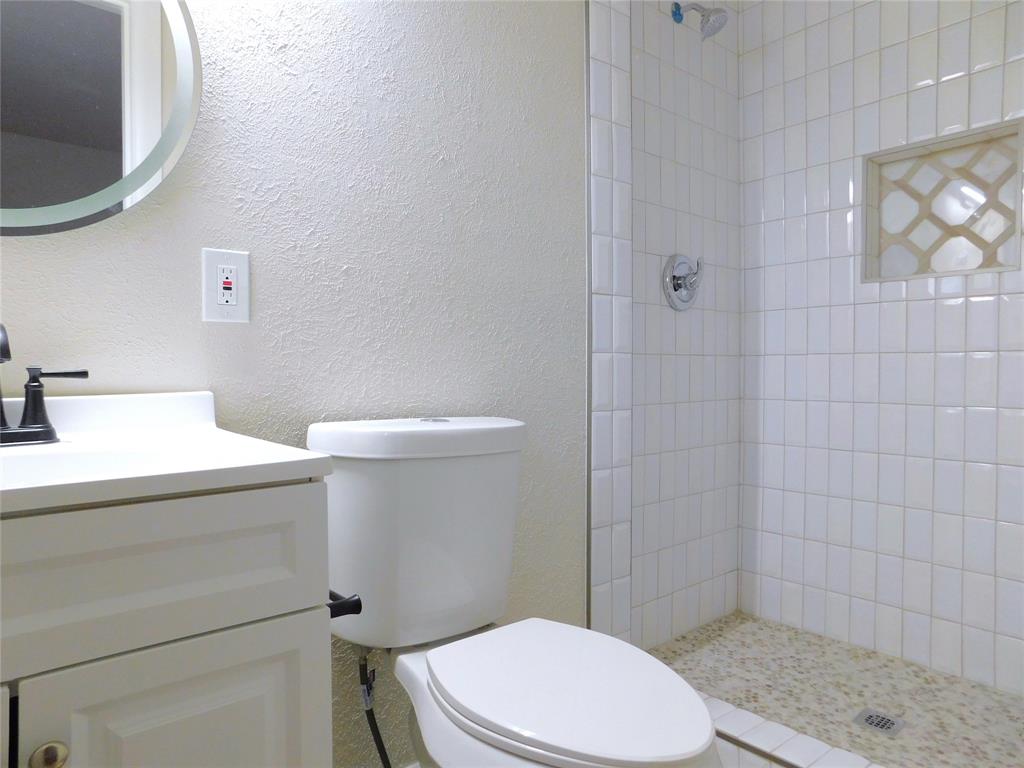 1716 Cordell Street Denton, TX 76201 - Photo 11 of 18 a bathroom with a sink a toilet and shower