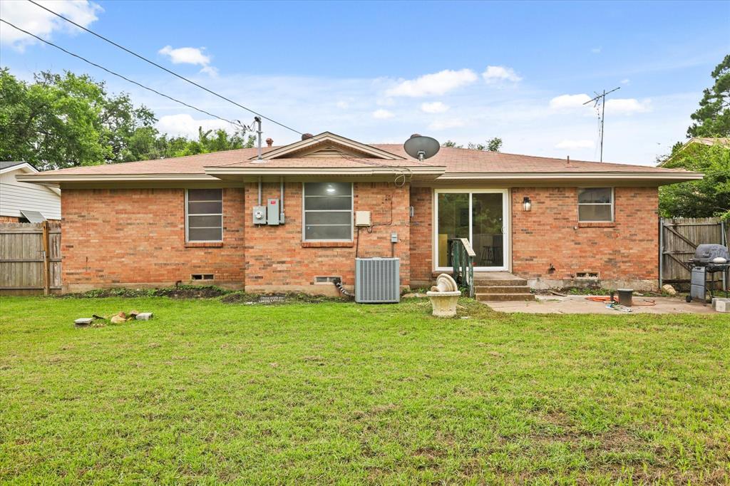 1716 Cordell Street Denton, TX 76201 - Photo 16 of 18 a view of a house with a yard and sitting area