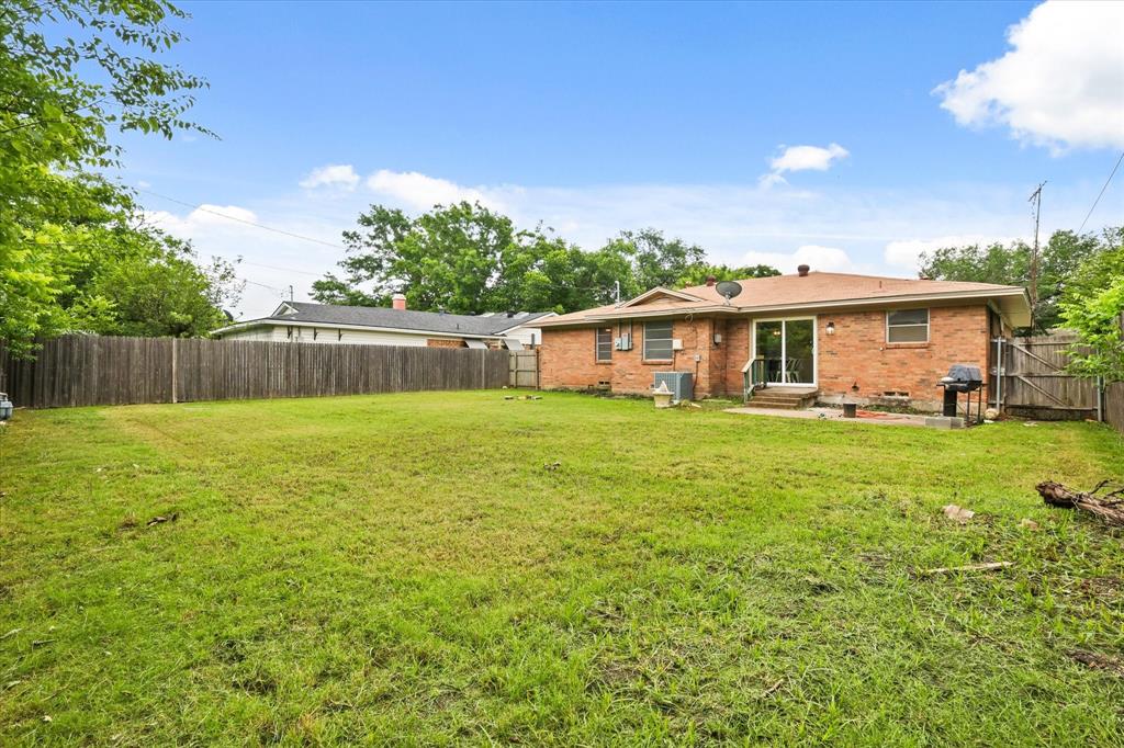 1716 Cordell Street Denton, TX 76201 - Photo 18 of 18 a view of house with a yard
