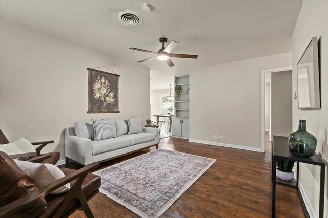 a living room with furniture and a rug